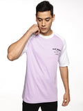 Lifestyle shot of ALP Mode Lilac Raglan T-Shirt paired with joggers