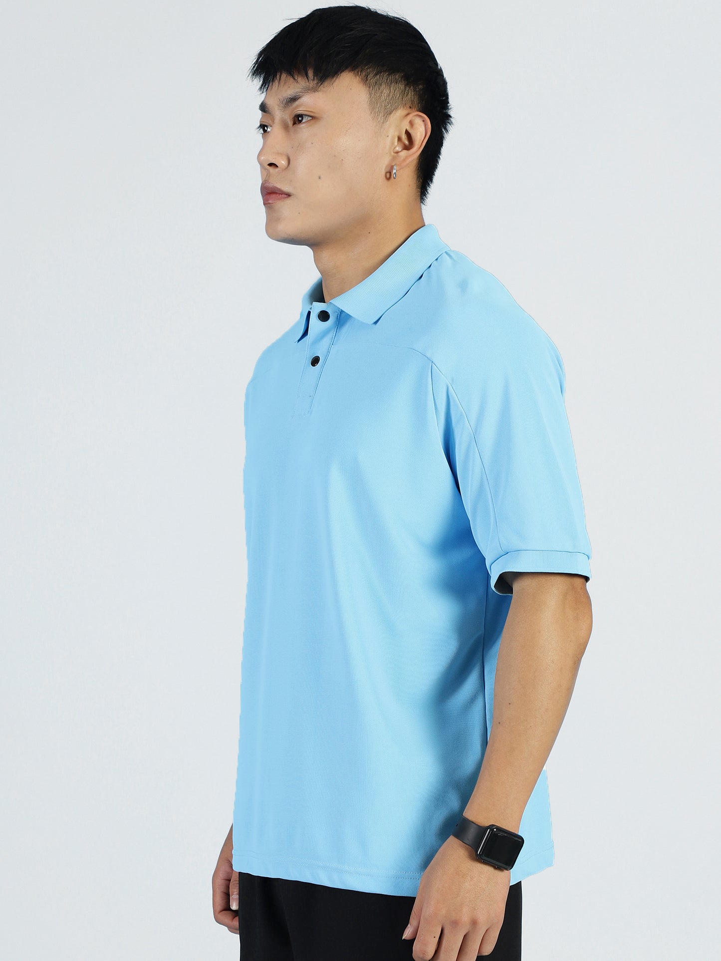 Lifestyle shot of ALP Mode Sky Blue Polo T-Shirt paired with shorts
