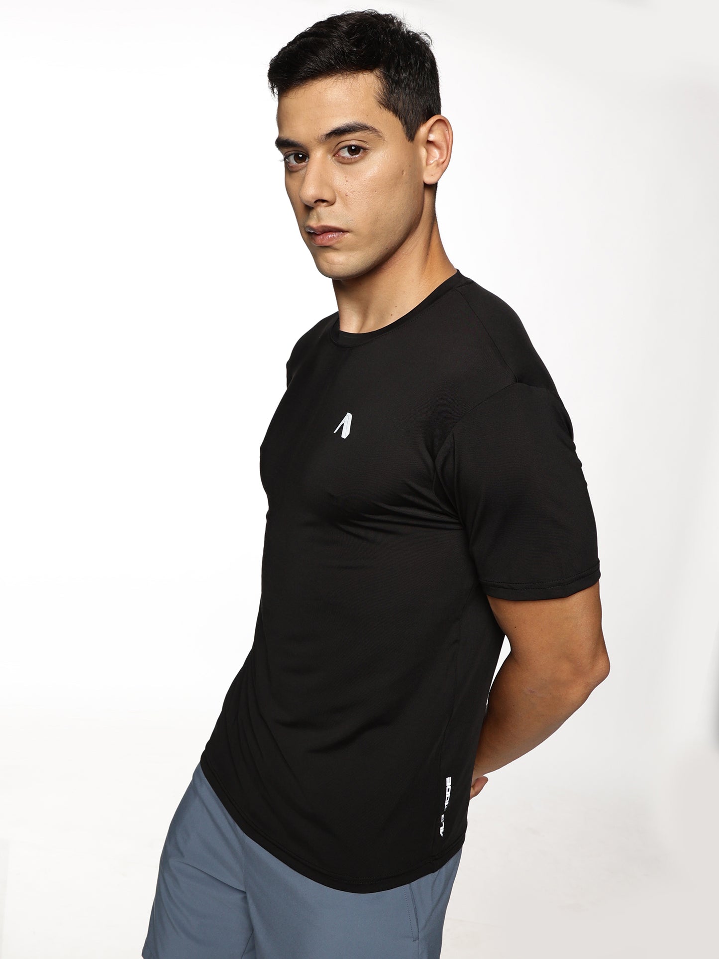 Model wearing ALP Mode Black Gym T-Shirt during workout