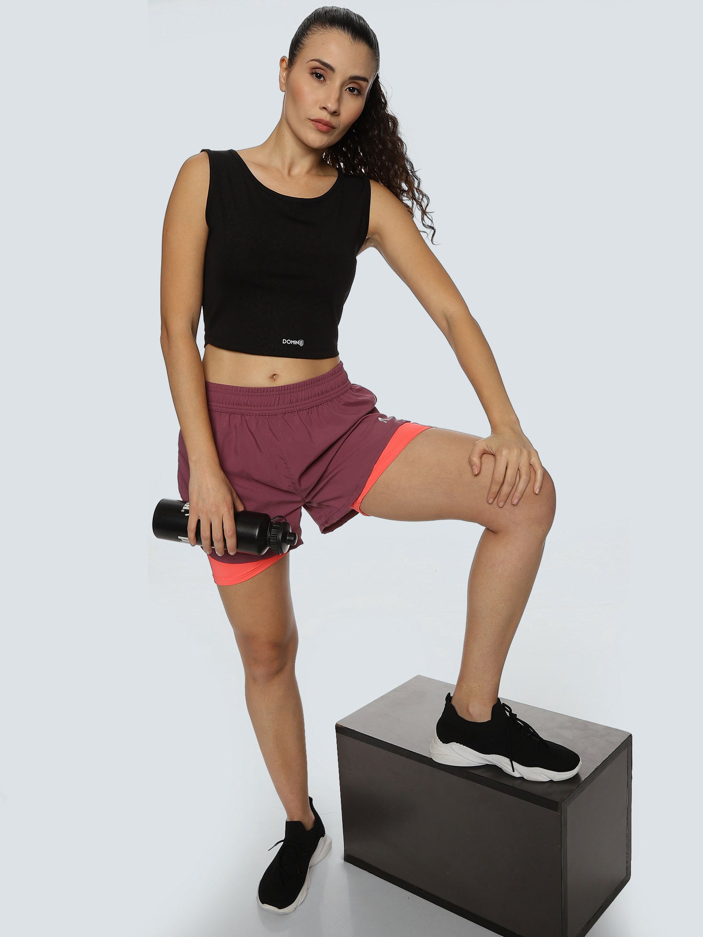 Model wearing ALP Mode Pink Shorts with Tights during workout