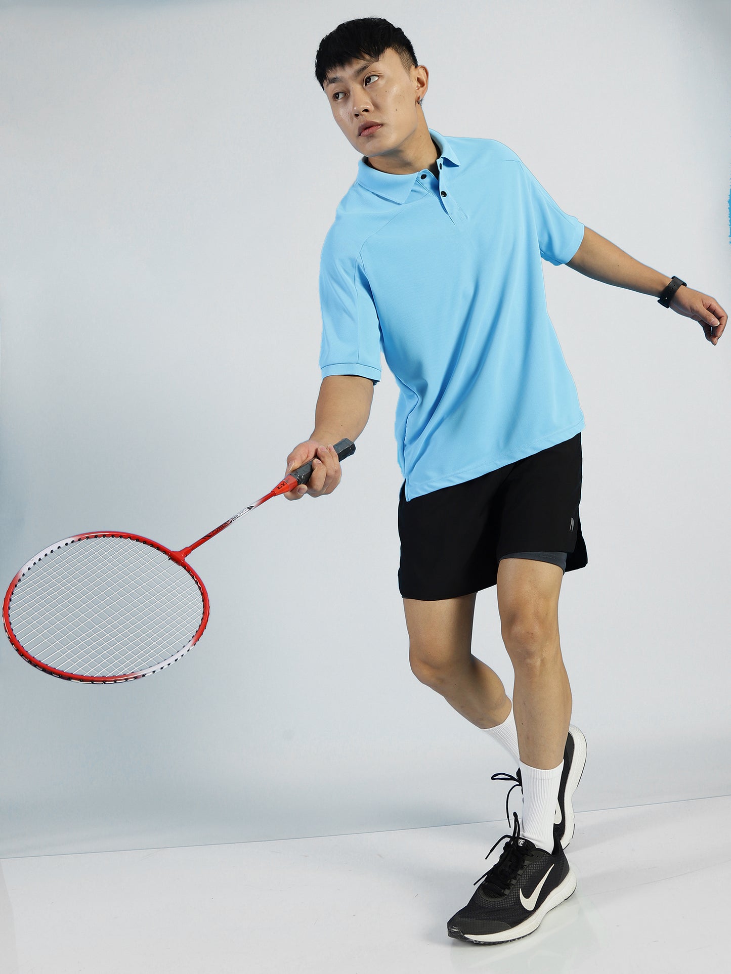 Model wearing ALP Mode Sky Blue Polo T-Shirt in casual setting