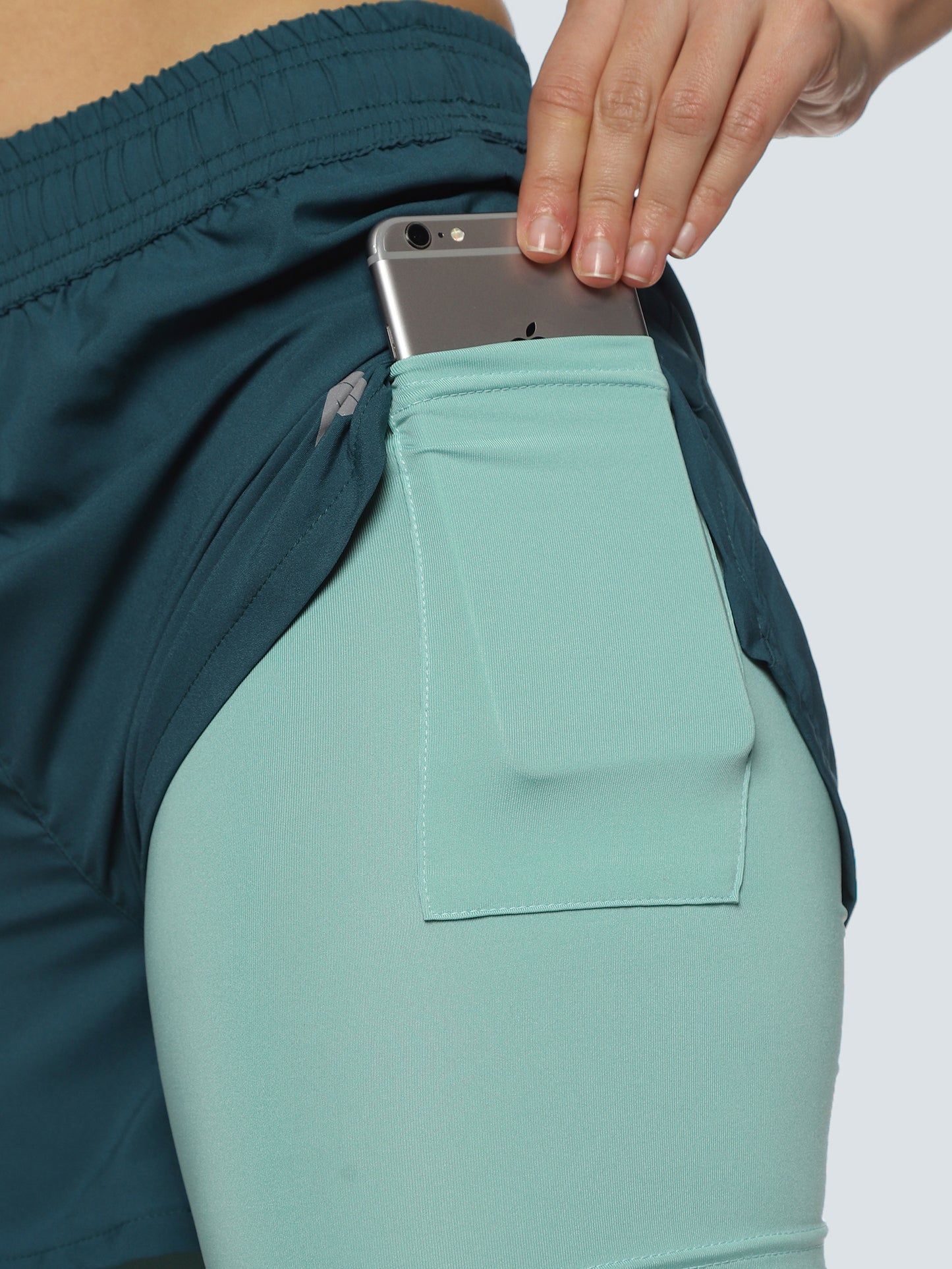Close-up of ALP Mode Green Shorts with Tights fabric – Breathable Activewear