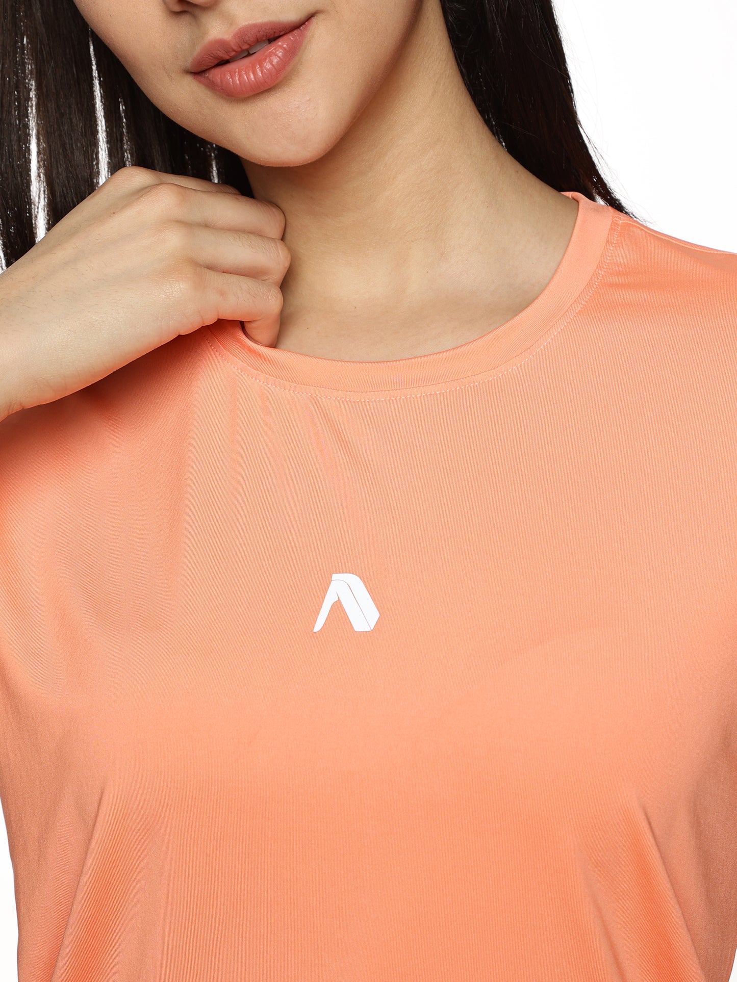 Close-up of ALP Mode Salmon Pink Performance T-Shirt fabric – Breathable Activewear