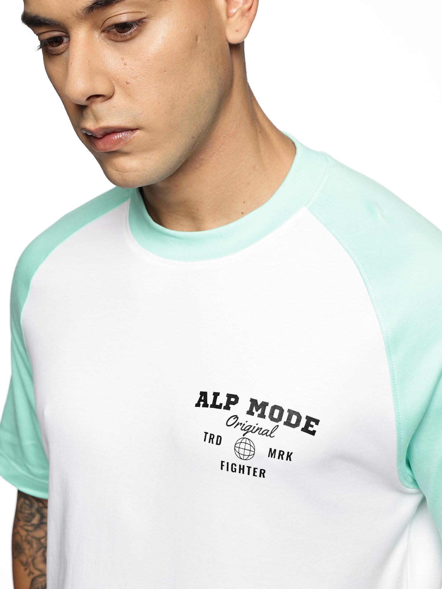 Close-up of ALP Mode Green Raglan Active T-Shirt fabric – Breathable Activewear