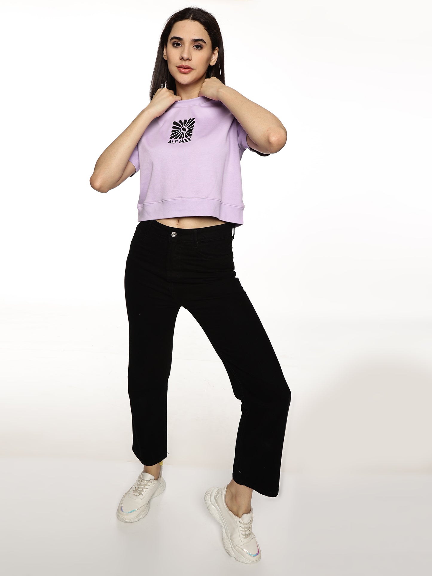 Lifestyle shot of ALP Mode Lilac Crop Top paired with leggings