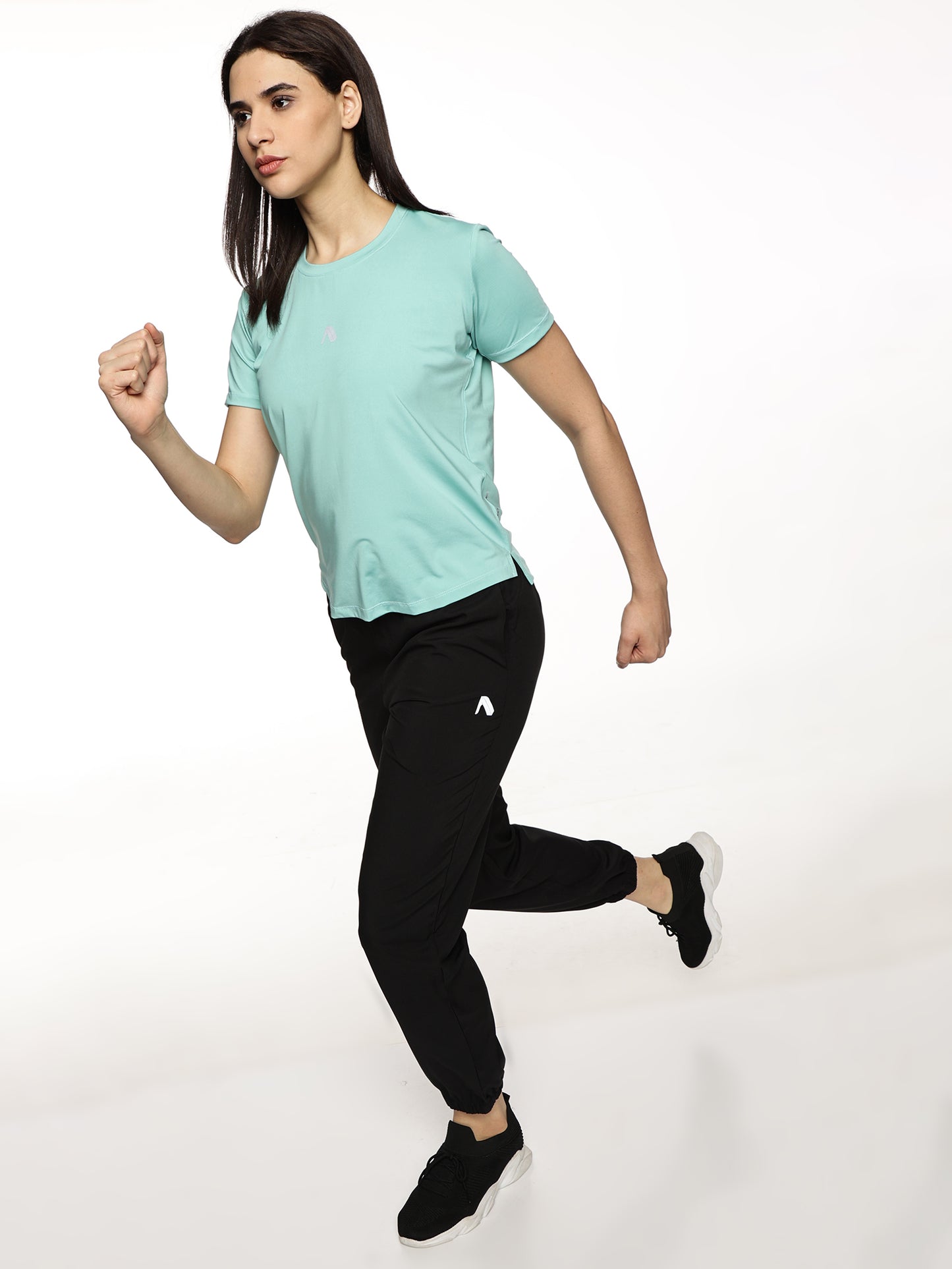 Lifestyle shot of ALP Mode Mint Performance T-Shirt paired with leggings
