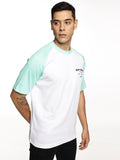 Model wearing ALP Mode Green Raglan Active T-Shirt during workout
