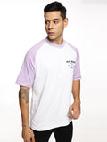 Lifestyle shot of ALP Mode Lilac Raglan Active T-Shirt paired with joggers