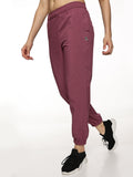 Lifestyle shot of ALP Mode Pink Running Track Pant paired with top
